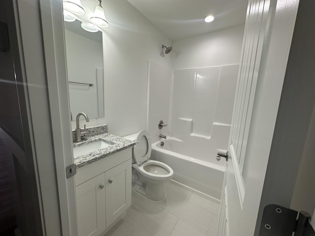 bathroom with toilet, bathing tub / shower combination, tile patterned flooring, and vanity