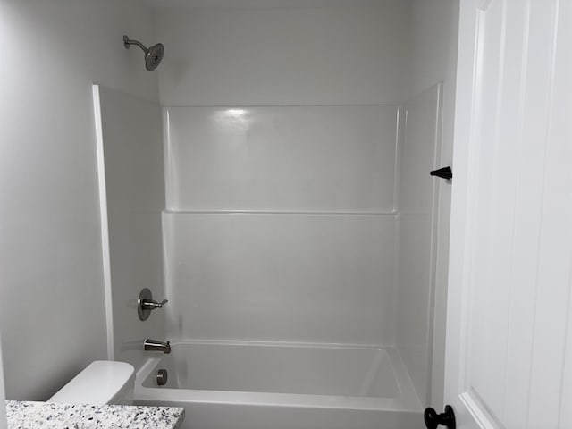 full bathroom with toilet and tub / shower combination