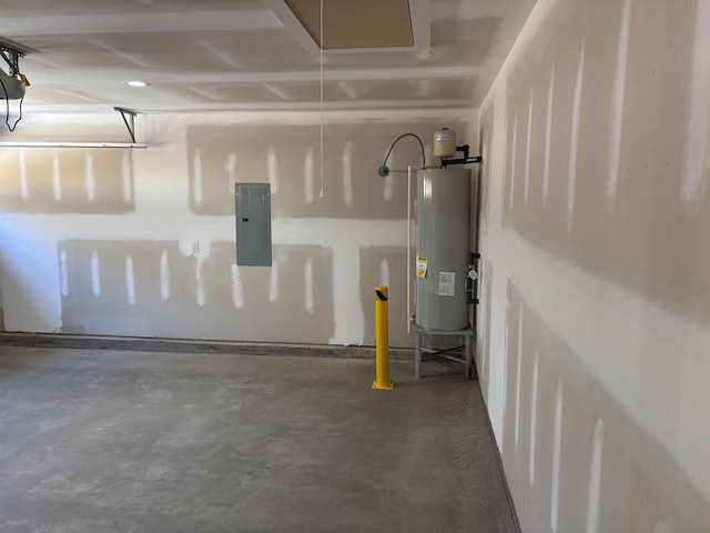 garage featuring electric panel and water heater