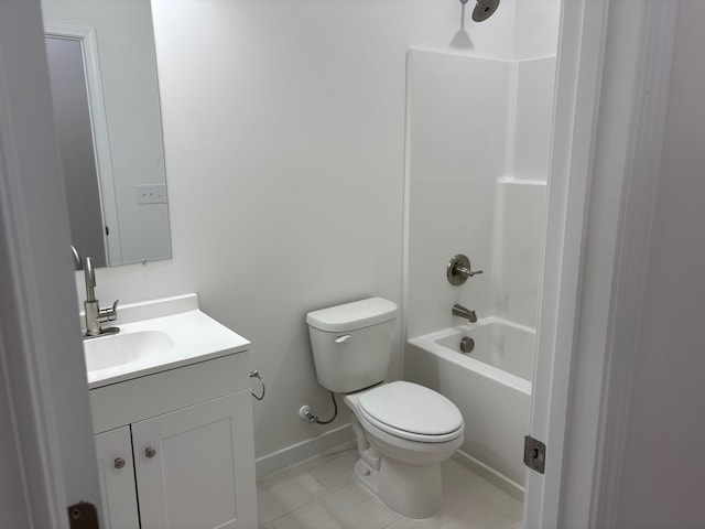 bathroom with bathtub / shower combination, toilet, vanity, baseboards, and tile patterned floors