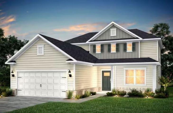 view of front facade featuring a garage, driveway, and board and batten siding