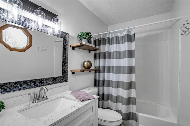 bathroom featuring a textured ceiling, toilet, shower / bath combination with curtain, and vanity