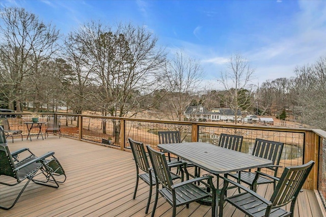 wooden deck with outdoor dining space