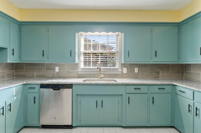 kitchen with green cabinetry, dishwasher, backsplash, light countertops, and a sink