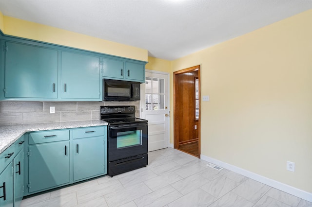 kitchen with baseboards, visible vents, blue cabinetry, black appliances, and backsplash