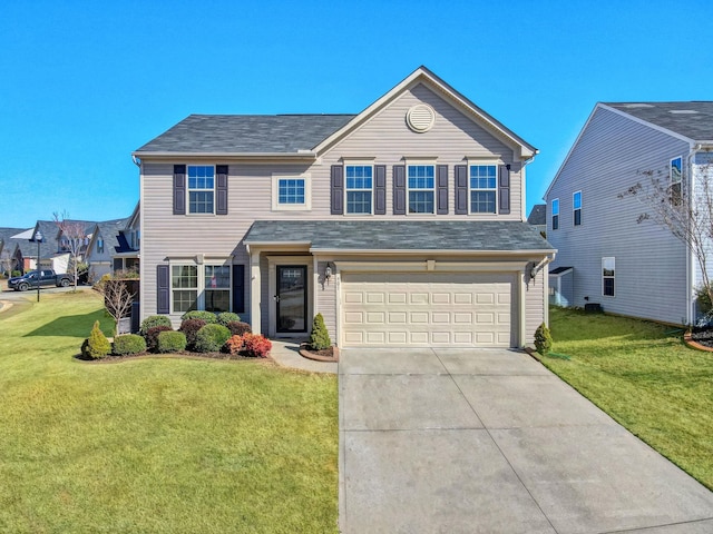 traditional-style home with a front yard, driveway, and an attached garage