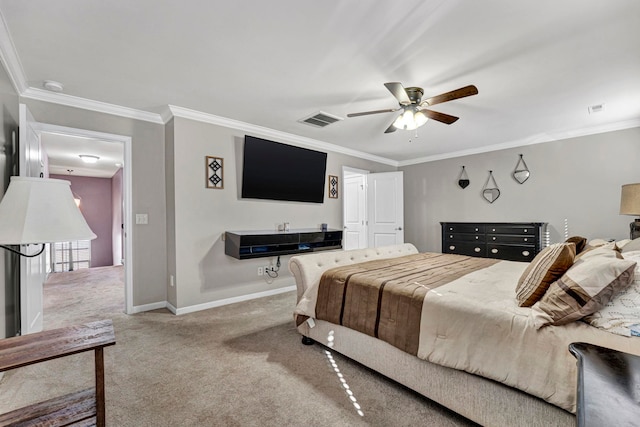 carpeted bedroom featuring visible vents, crown molding, and baseboards