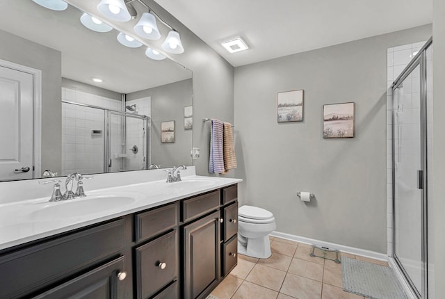 full bathroom with a sink, a shower stall, and tile patterned floors