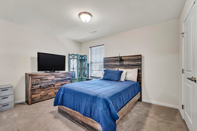 bedroom featuring carpet, visible vents, and baseboards