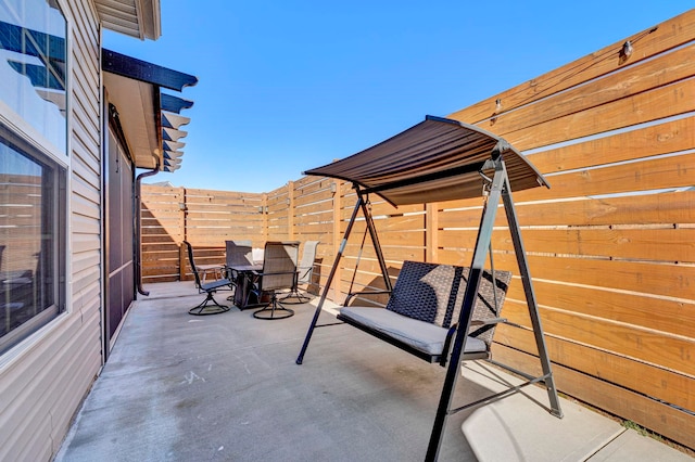 view of patio / terrace featuring outdoor dining space and fence