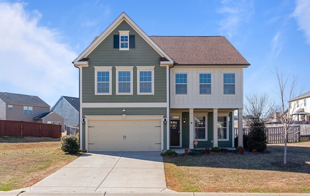 view of front of house featuring concrete driveway, board and batten siding, a front yard, and fence