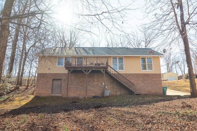 back of property featuring central AC, brick siding, stairway, and a wooden deck