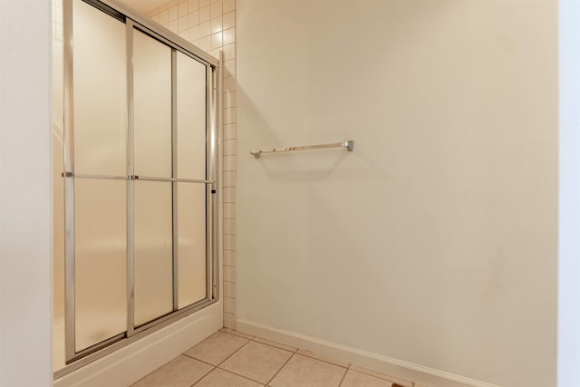 bathroom with tile patterned flooring and baseboards