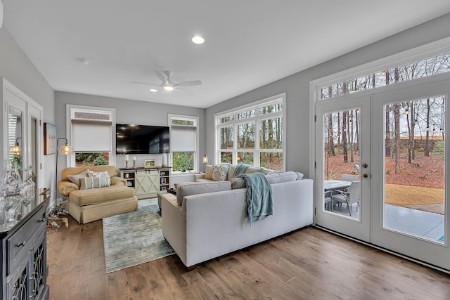 living area featuring recessed lighting, a ceiling fan, wood finished floors, and french doors