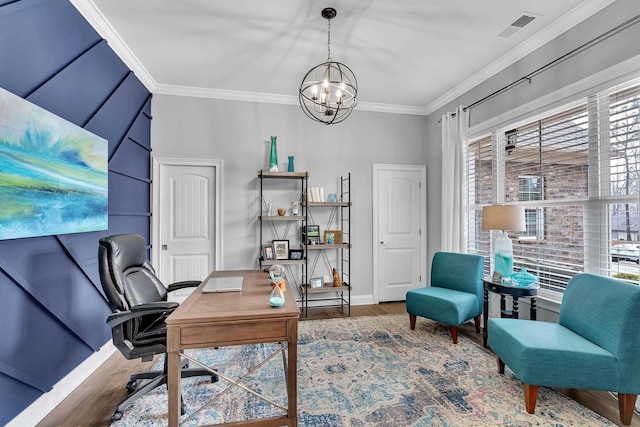 office area with wood finished floors, visible vents, baseboards, ornamental molding, and an inviting chandelier