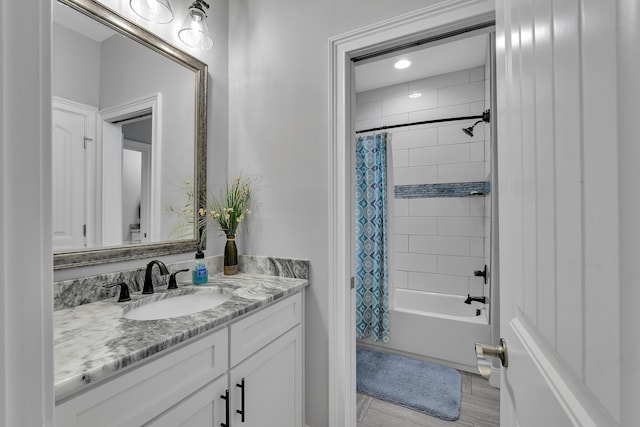 full bath featuring shower / tub combo with curtain and vanity