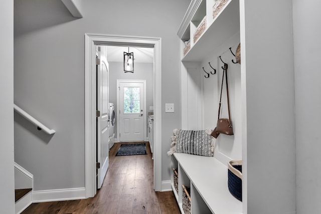 mudroom featuring washer / dryer, dark wood-style flooring, and baseboards