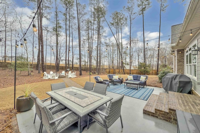 view of patio / terrace with an outdoor hangout area, outdoor dining space, area for grilling, and fence private yard