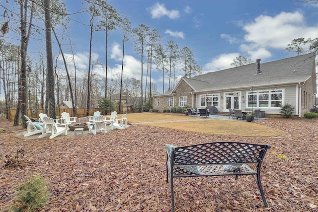 view of yard with an outdoor fire pit and a patio