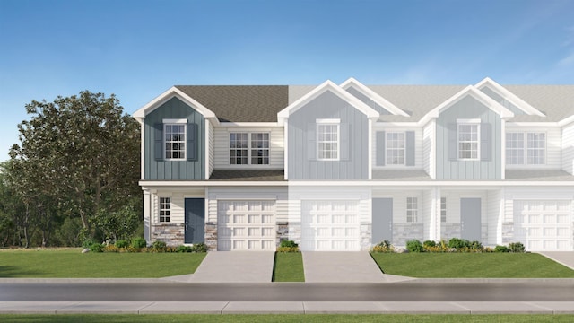 view of front of house with concrete driveway, stone siding, an attached garage, board and batten siding, and a front yard