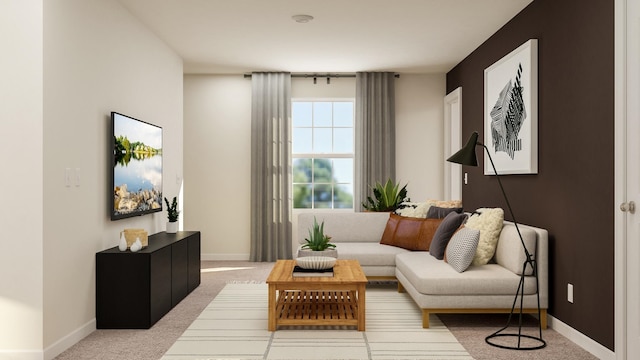 sitting room featuring carpet floors and baseboards