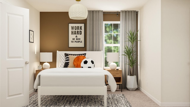 bedroom featuring carpet and baseboards