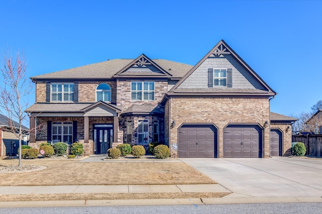 view of front of home with a garage, concrete driveway, brick siding, and roof with shingles