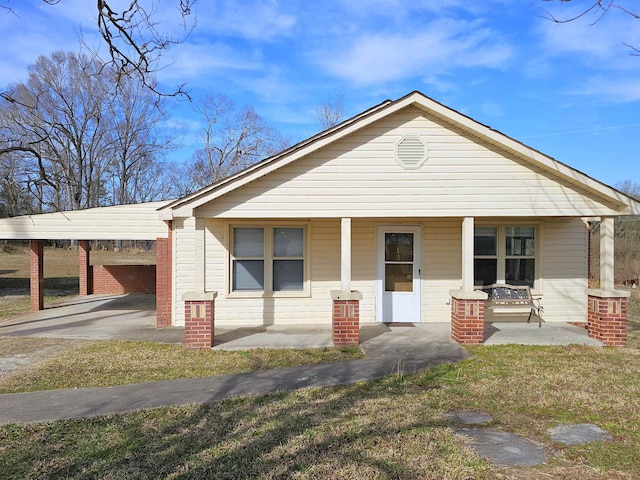 view of front of property with covered porch and a front yard