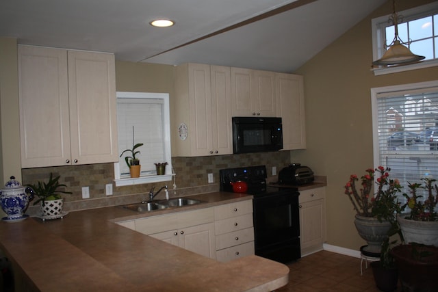 kitchen with a sink, white cabinets, hanging light fixtures, backsplash, and black appliances