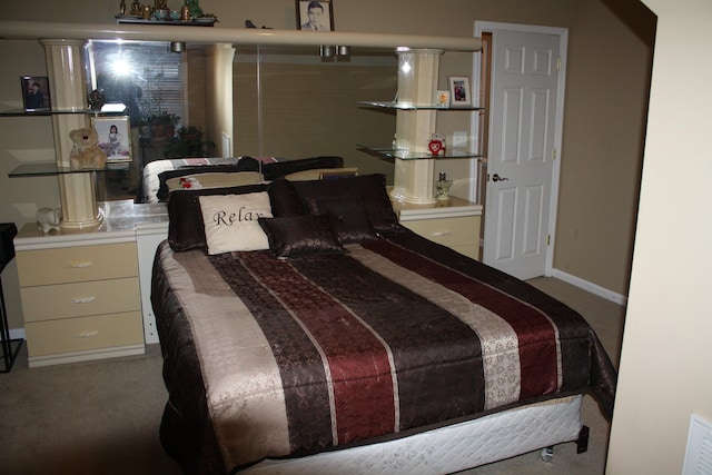 bedroom featuring carpet floors and baseboards