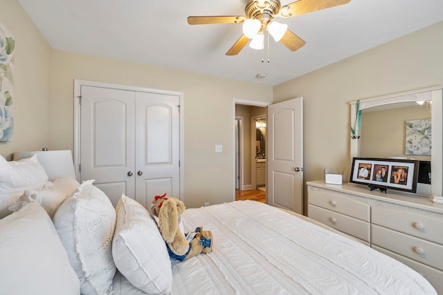 bedroom with ceiling fan and a closet