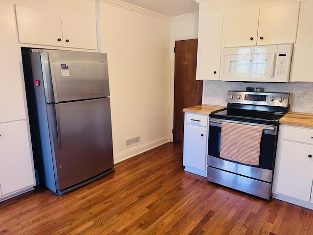 kitchen with white cabinets, visible vents, stainless steel appliances, and ornamental molding