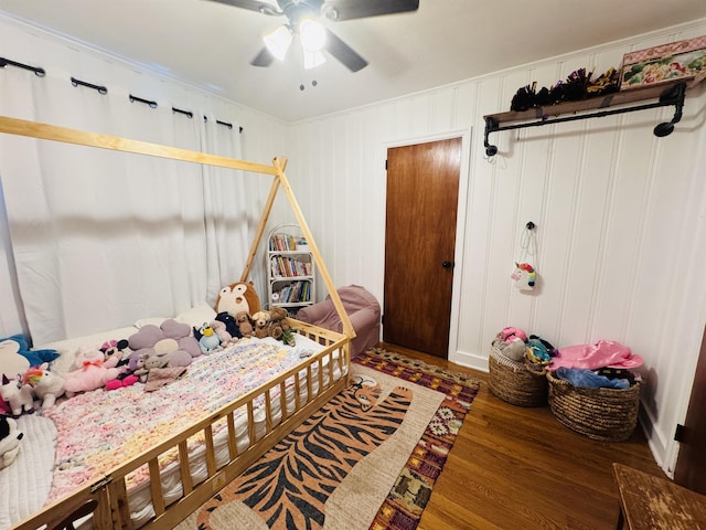 bedroom featuring dark wood-type flooring and ceiling fan