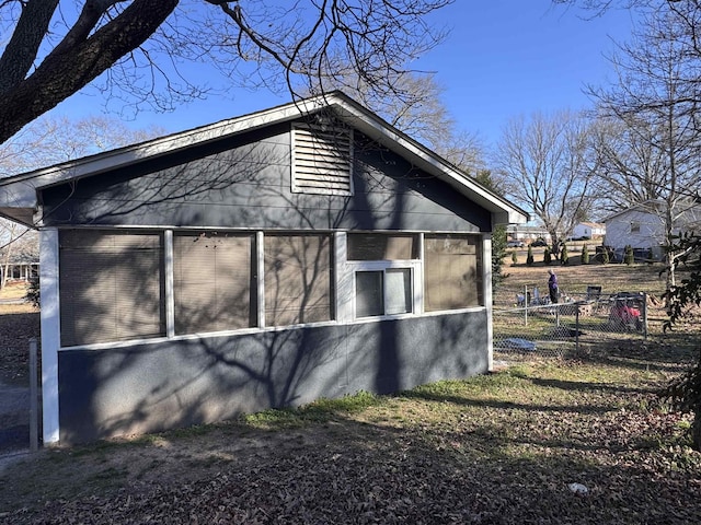 view of home's exterior featuring fence