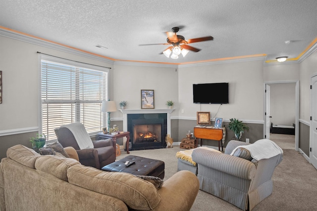 living room with a fireplace with flush hearth, ornamental molding, a textured ceiling, and light colored carpet