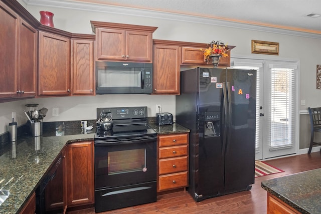 kitchen with black appliances, crown molding, visible vents, and dark wood-type flooring