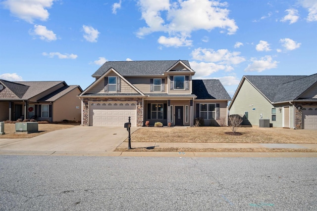 craftsman-style house featuring stone siding, concrete driveway, and central AC unit