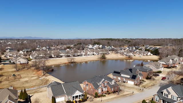 bird's eye view with a residential view and a water view