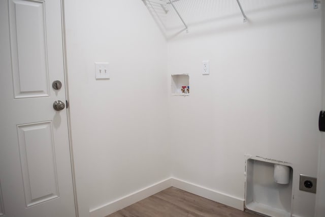 washroom featuring washer hookup, hookup for an electric dryer, wood finished floors, laundry area, and baseboards