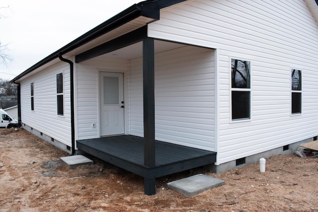 view of side of property featuring crawl space