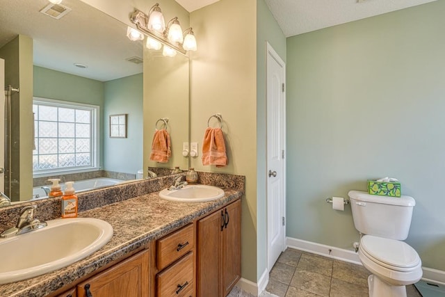 full bathroom with double vanity, visible vents, a sink, and a bath