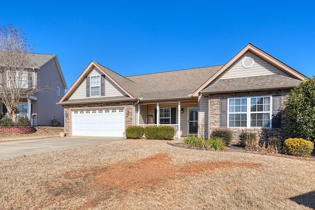 view of front of house featuring a porch, a garage, a shingled roof, concrete driveway, and stone siding