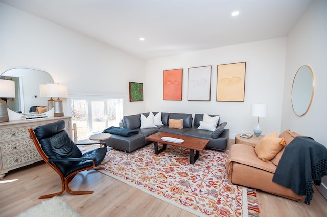 living area featuring light wood-style floors, lofted ceiling, and recessed lighting