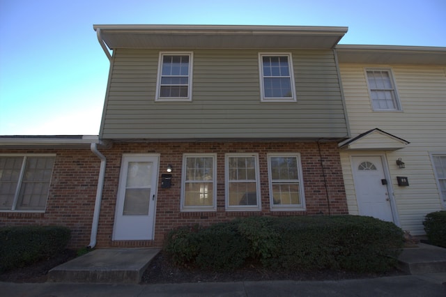 multi unit property featuring brick siding