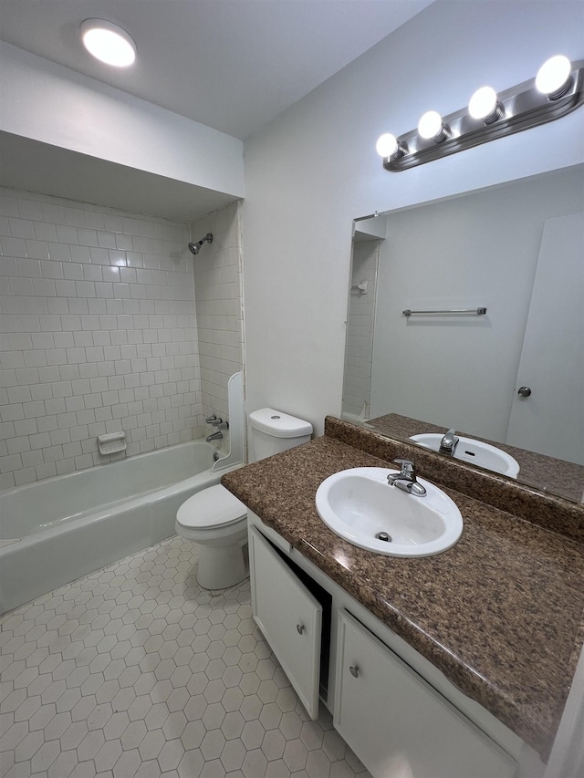 full bath featuring tile patterned flooring, shower / bath combination, vanity, and toilet