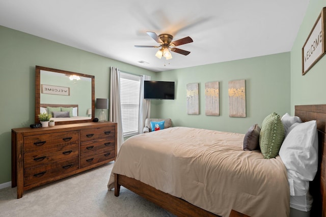 bedroom with a ceiling fan, light carpet, and visible vents