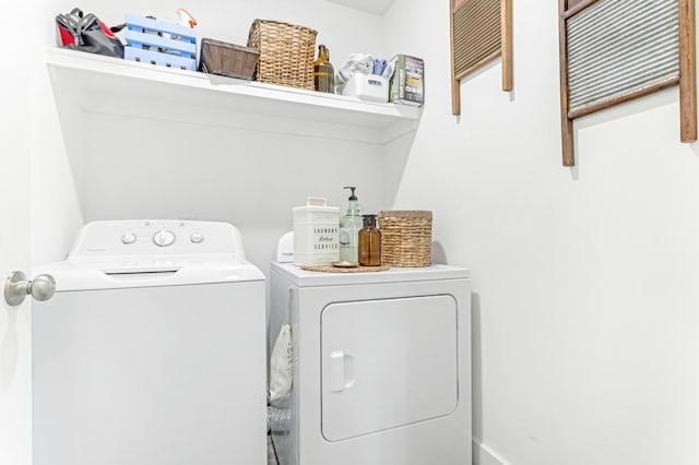 washroom featuring laundry area and washing machine and dryer