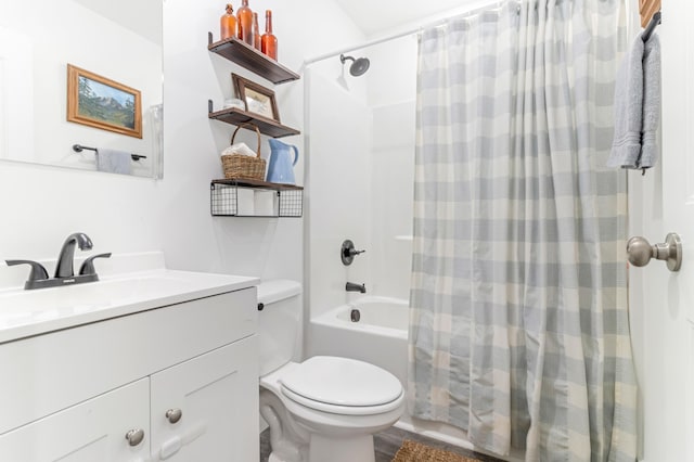 bathroom featuring shower / tub combo with curtain, vanity, and toilet