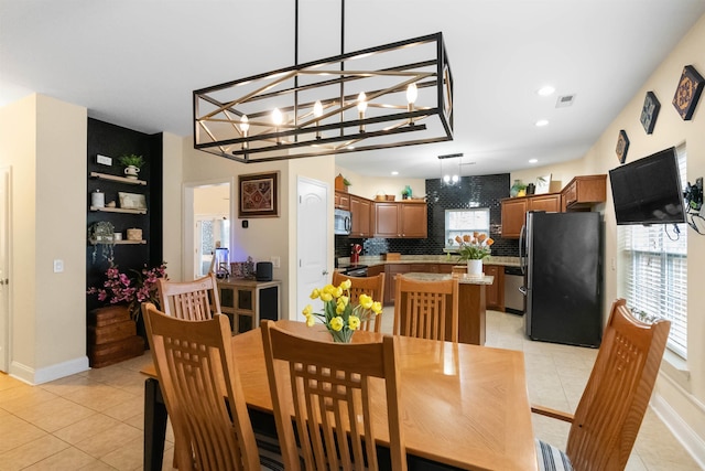 dining room with light tile patterned floors, recessed lighting, visible vents, and a healthy amount of sunlight