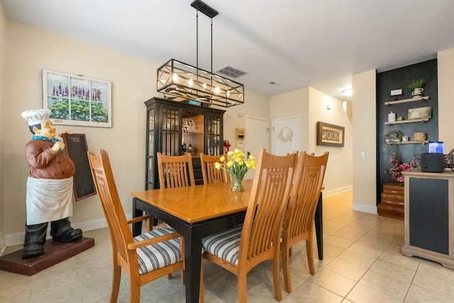 dining space featuring visible vents, baseboards, and light tile patterned floors